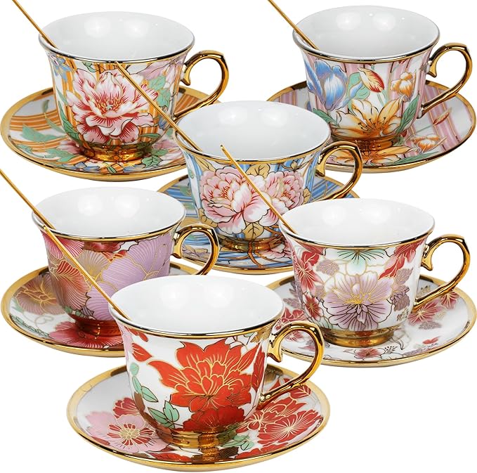 Six vintage floral teacups and saucers with gold trim, arranged on a table.  8oz ceramic teacups and saucers, perfect for tea, coffee, or gifts.